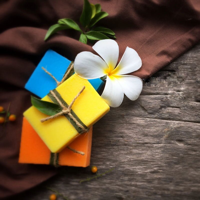 natural oil soap with plumeria flower on wooden background t20 mR8o4m